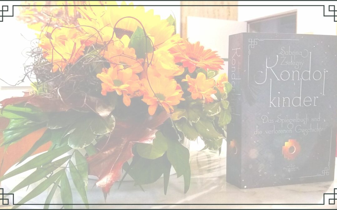 Auf einem Marmortisch stehen ein Strauß Blumen, daneben das Buch Kondorkinder.